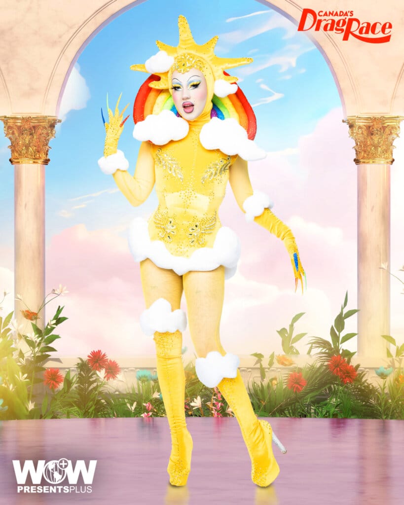 Denim posing for Canada's Drag Race Season 4 promo for Meet The Queens in a yellow outfit.