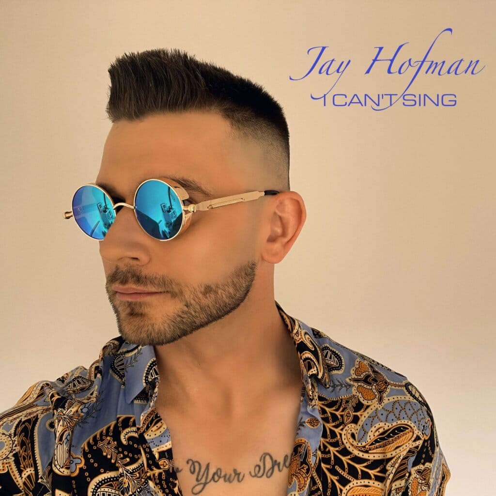 Jay Hofman Unveils Catchy Indie Electro-Pop Earworm "I Can't Sing" 4 Official single cover artwork for "I Can't Sing" which sees Jay Hofman facing slightly to the left, wearing a light-blue patterned-gold shirt, and blue shades.