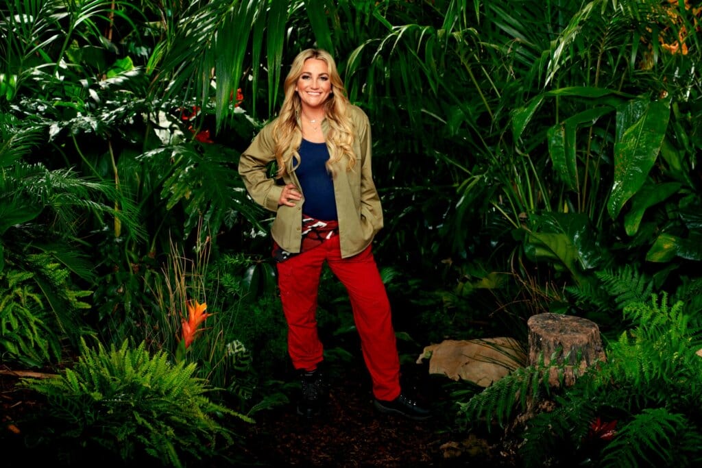 Famous Faces, Fearful Fates: I'm a Celebrity… Get Me Out of Here! 2023 Cast Has Been Revealed 67 Promotional photo for I'm A Celebrity... Get Me Out Of Here! 2023, which sees Jamie Lynn Spears in a jungle setting, wearing the camp uniform.
