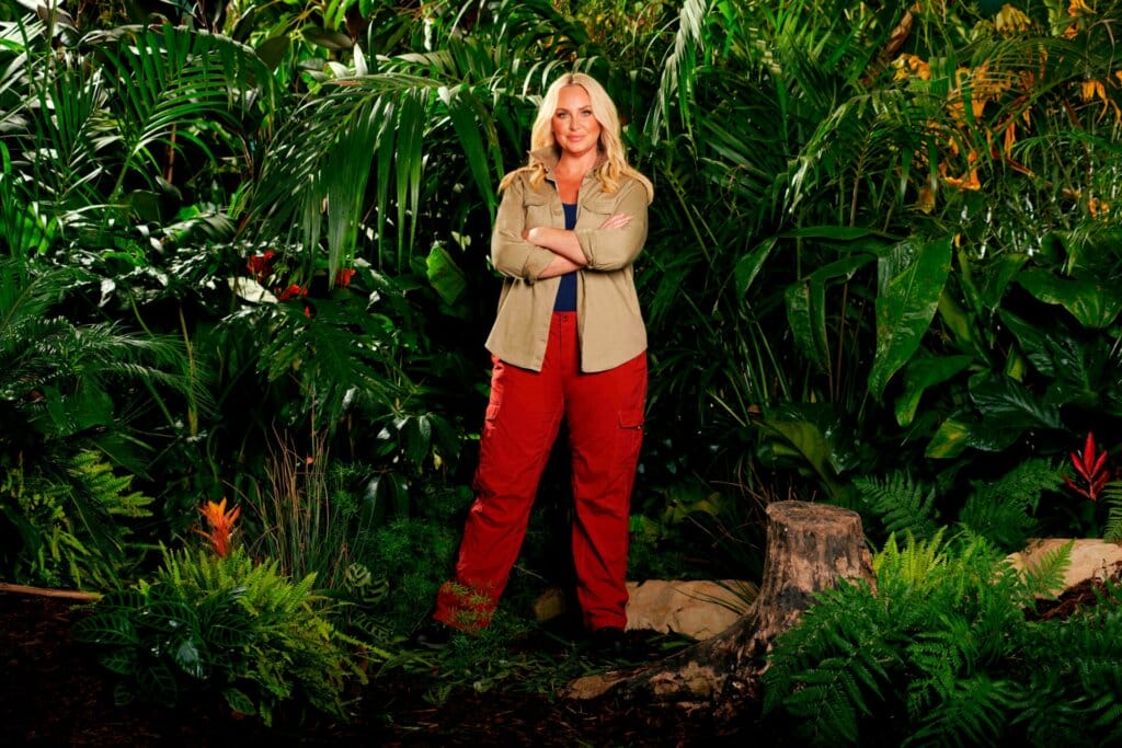 Famous Faces, Fearful Fates: I'm a Celebrity… Get Me Out of Here! 2023 Cast Has Been Revealed 61 Promotional photo for I'm A Celebrity... Get Me Out Of Here! 2023, which sees Josie Gibson in a jungle setting, wearing the camp uniform.