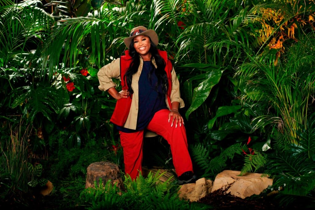 Promotional photo for I'm A Celebrity... Get Me Out Of Here! 2023, which sees Nella Rose in a jungle setting, wearing the camp uniform.