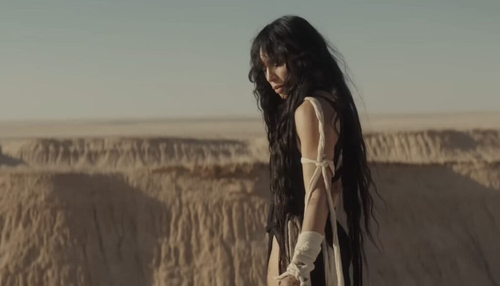 Loreen Captivates In Gorgeous Desert Scenery Music Video For "Is It Love" 19 Still from the "Is It Love" music video which sees Loreen overlooking desert hills.