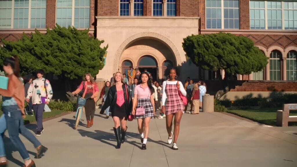 Walmart's Mean Girls Reunion with Lindsay Lohan, Amanda Seyfried, and Lacey Chabert: A Jaw-Dropping Fetch Black Friday Delight 2 Still from Walmart's Mean Girls reunion advert which sees three new Plastics in front of the school.