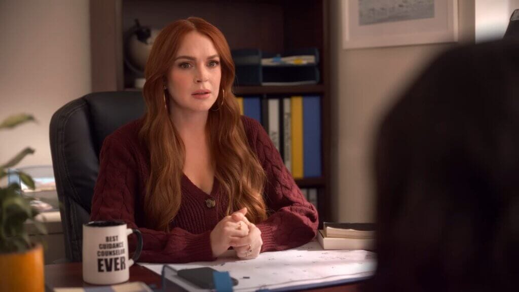 Walmart's Mean Girls Reunion with Lindsay Lohan, Amanda Seyfried, and Lacey Chabert: A Jaw-Dropping Fetch Black Friday Delight 9 Still from Walmart's Mean Girls reunion advert which sees Lindsay Lohan as the guidance counsellor.
