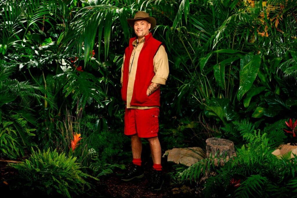 The Voting Percentages of I'm a Celebrity… Get Me Out of Here! 2023 Has Been Revealed by ITV and Sam Thompson Didn't Quite Win by an Epic Landslide 42 Promotional photo for I'm a Celebrity… Get Me Out of Here! 2023, which sees Tony Bellew in a jungle setting, wearing the camp uniform.