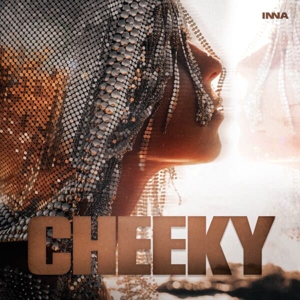 "Cheeky": INNA Drops New Addicting Dance Single With Awesome Choreographed Music Video 18 Single cover artwork for "Cheeky" which is a side image of INNA's face, showing her cheek, while she wears a metal beaded head scarf that has metal beads falling across her face.