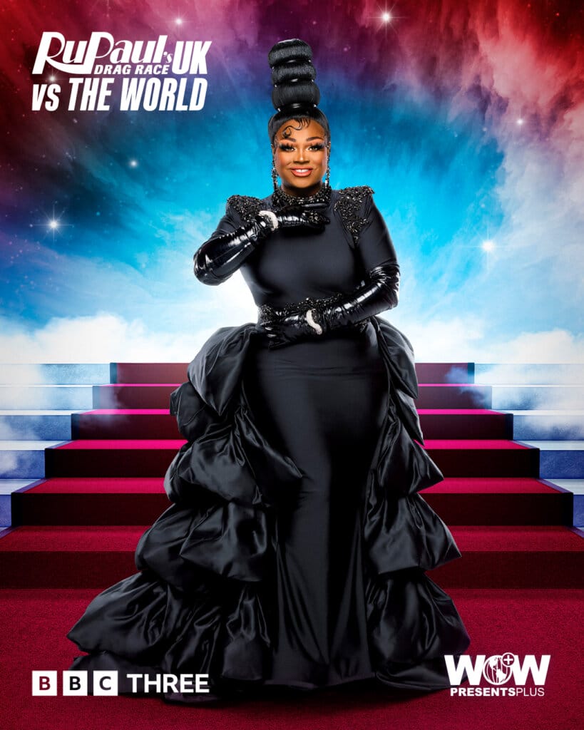 Mayhem Miller from RuPaul's Drag Race UK vs the World series 2, posing in a black dress with a trail while a red carpet of stairs is behind her.