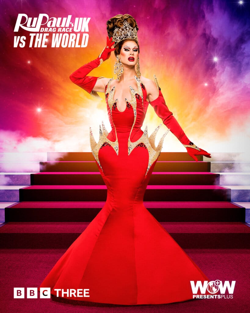 Slaying the World: Follow the Queens of RuPaul's Drag Race UK vs the World Series 2 107 Scarlet Envy from RuPaul's Drag Race UK vs the World series 2, posing in a royal red dress with a red carpet of stairs behind her.