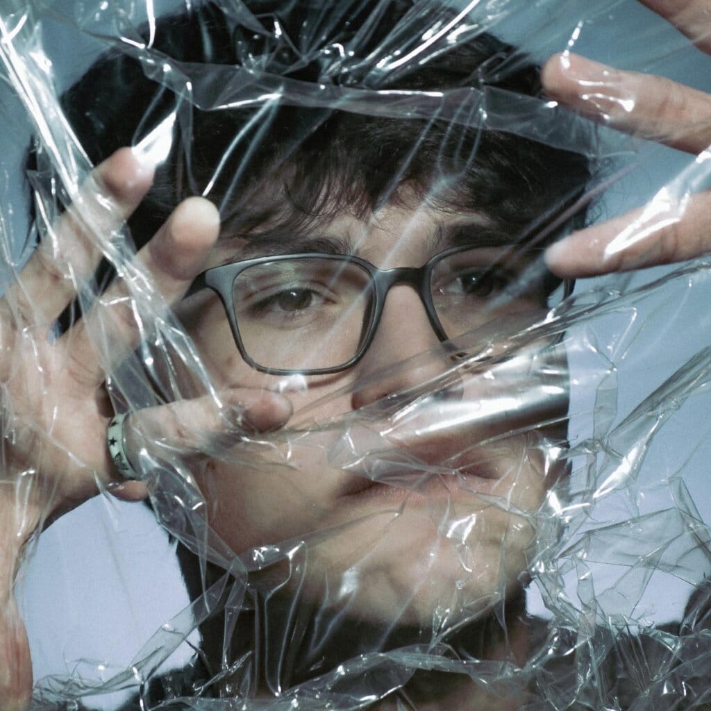 "Half of You": Delving into Emotional Turmoil Rob Eberle Releases Incredible Latest Single 10 Official single cover artwork for "Half of You" which sees a head shot of Rob Eberle with a plastic sheet over his face.