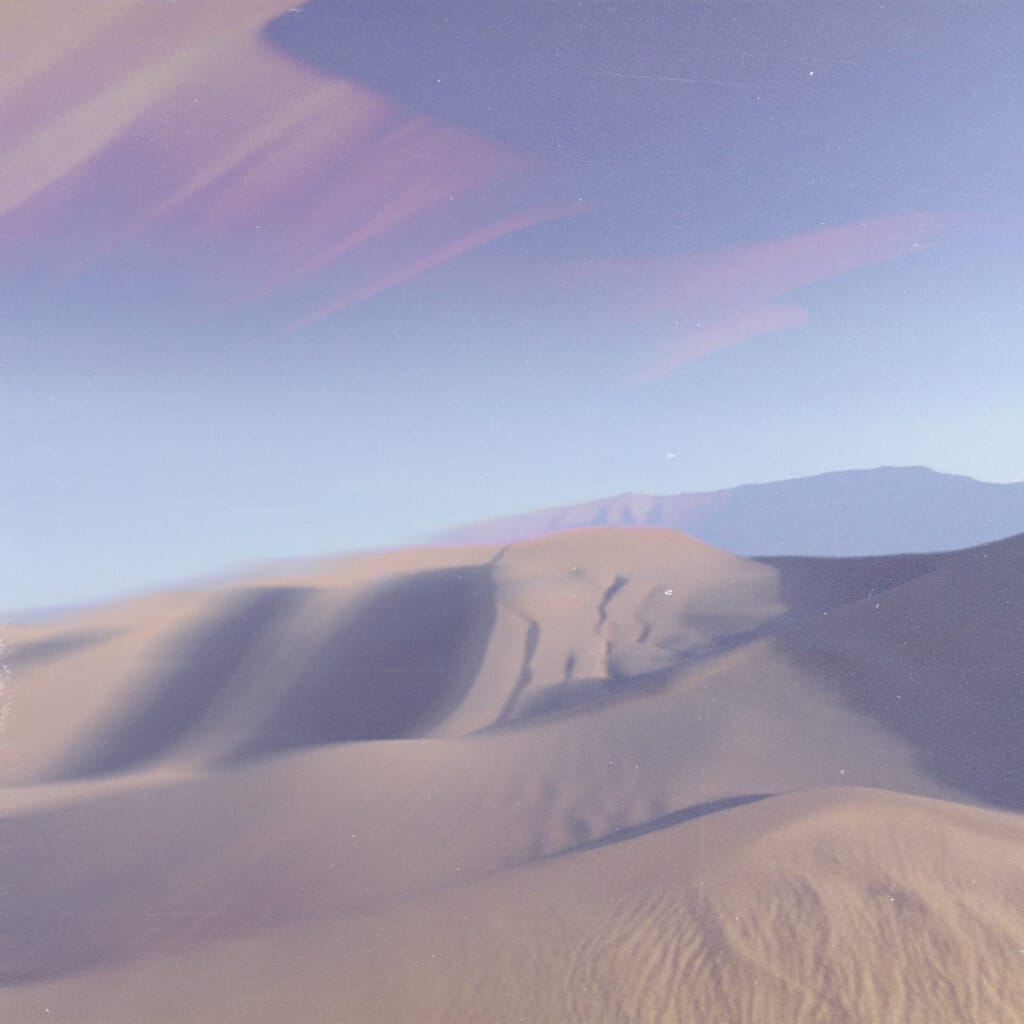 Official single artwork for "Lilo" by Jacana People which showcases desert hills with a lavender sky.