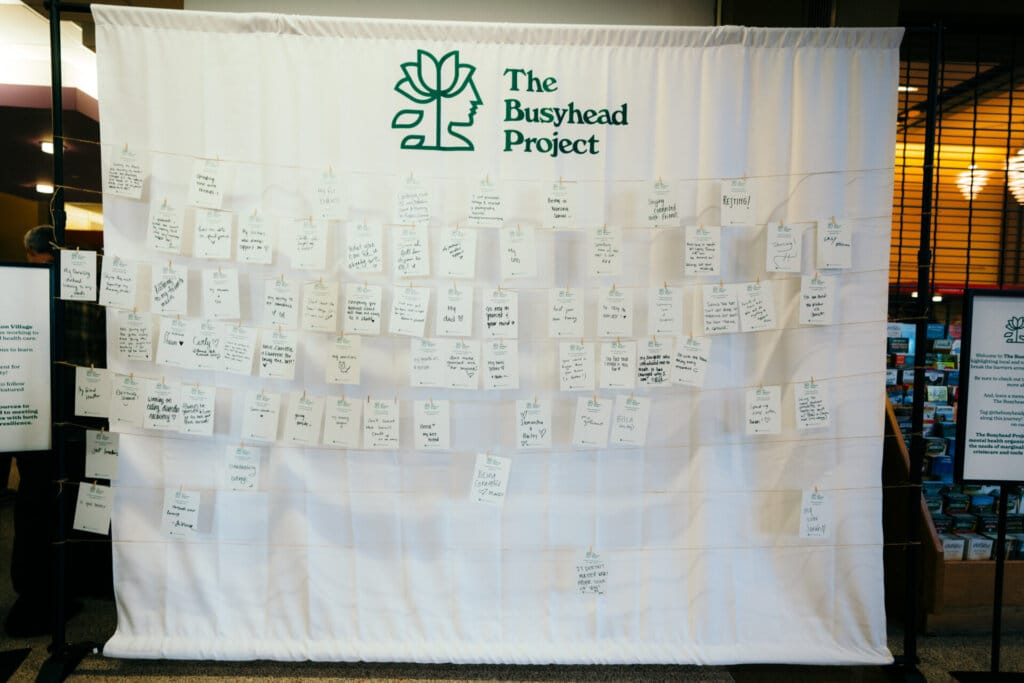 Noah Kahan and The Busyhead Project Launch Mental Health Awareness Campaign in Connection With His "We'll All Be Here Forever Tour" 11 A wall of messages that fans have left as part of The Busyhead Project Community Wall.