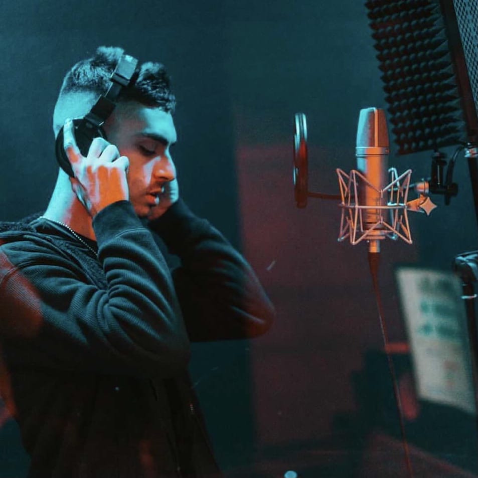 "Sunburst": Jesse Eplan Shines Bright With His Captivating New Single and Music Video 2 Jesse Eplan in the recording studio, laying down some vocals.