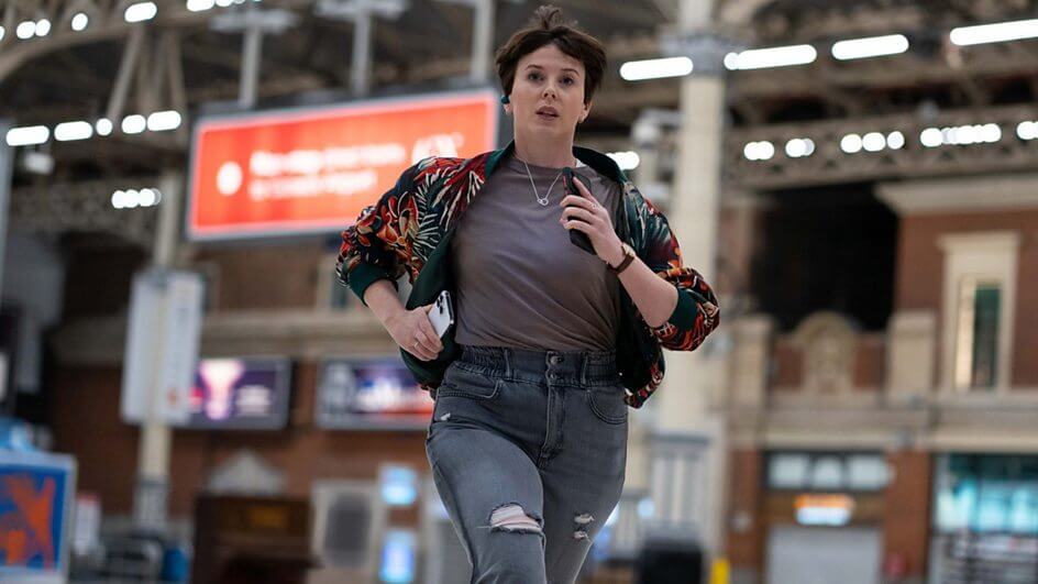 Still from the Nightsleeper trailer which sees a woman (Alexandra Roach) running through a train station.
