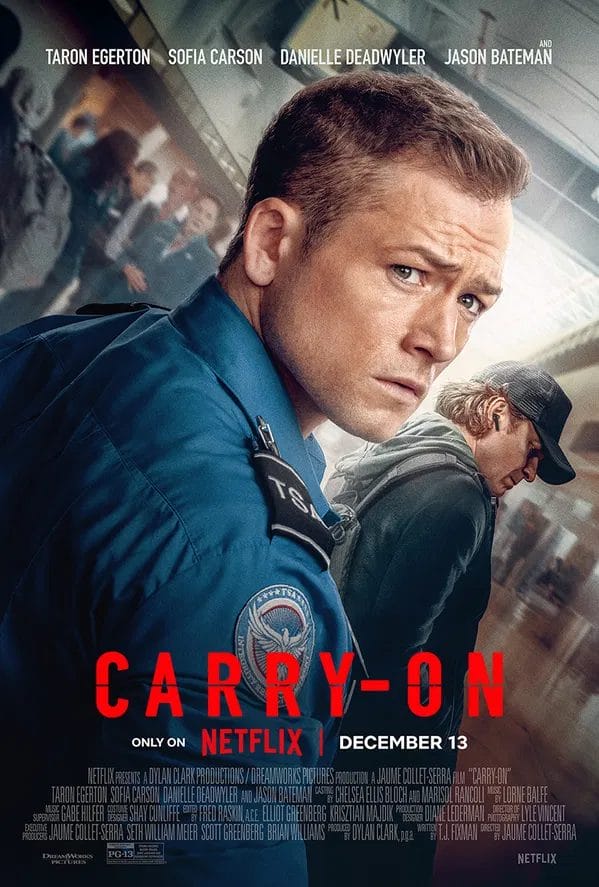 Netflix's Carry-On Epic Film Trailer: Sofia Carson and Taron Egerton Heat Up a Romance That Jason Bateman Turns Into a Suspenseful Thriller 48 Official poster for Netflix's Carry-On film which shows Taron Egerton as TSA agent Ethan Kopek looking over his shoulder while dressed in a bight blue uniform shirt, with a crowd of people behind him, one of which is Jason Bateman playing the Mysterious Traveller who is dressed all in black with a black baseball cap.
