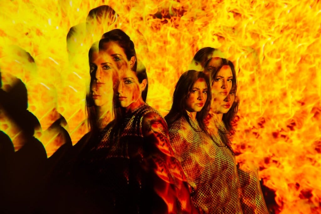 Royal She Reflects on New Single "Karma", Their Rising Success, and Forthcoming Debut Album "Befores and Afters" in Our Exclusive Interview 68 Royal She posing together in a distorted fire-like image.
