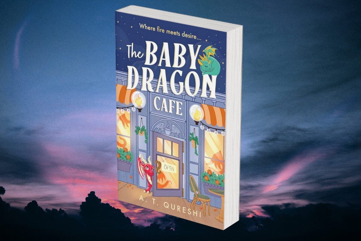 A twilight sky background with the book cover of "The Baby Dragon Cafe" by A. T. Qureshi in the foreground, which shows a cartoon-style cafe with cute small dragons, in pastel colours.