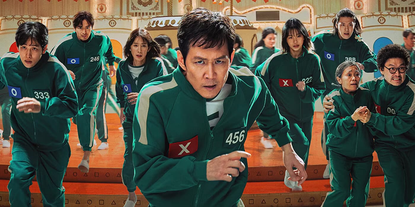 Official promotional image from Netflix of Squid Games Season 2 which sees the players running off the mega turntable, dressed in the green tracksuits.