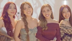 Still from the live cover video of 4th Impact smiling as they just finish singing "Die With a Smile" originally by Lady Gaga and Bruno Mars.