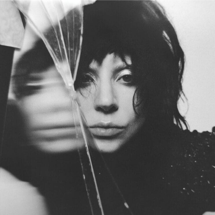 We All Crave Mayhem and Chaos: The Cultural Relevance of Lady Gaga's Forthcoming Album 15 Official album artwork for "Mayhem" which shows a black and white head-shot of Lady Gaga as a reflection in a mirror while there's a crack across the mirror, shattering it into a few different pieces.