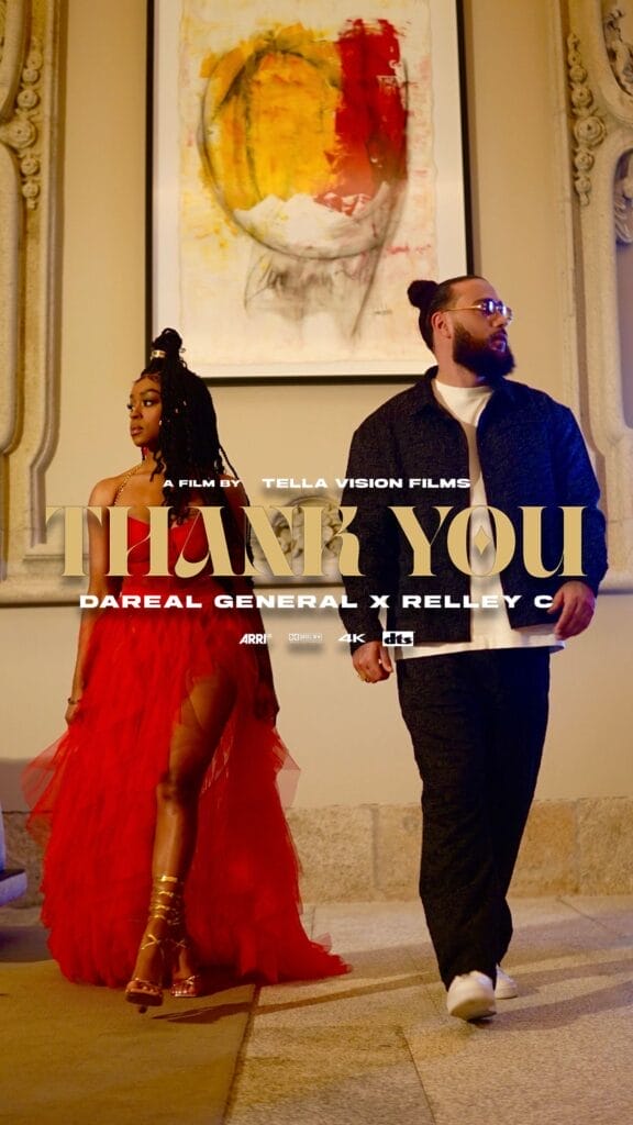 "Thank You": Relley C and Dareal General Fuse Amapiano, R&B, and Soul in New Collaborative Single Celebrating Growth, Strength, and Success 27 Used as the official single cover artwork, we see Relley C strutting towards the camera in her red dress with Dareal General also walking towards the camera. They're in-step and have their heads turned away from one another. The single's title is in the middle in gold along with the artists' names in white. There's a art picture on the wall in the background.