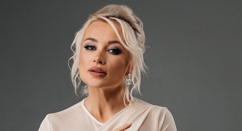 Ukrainian Artist ANGELA’s Optimistic New Single "Більше не плачу" ("No More Tears") Reminds Us Strength Comes After Pain 16 A close-up image of ANGELA who is wearing a beige top and her make-up is on point.