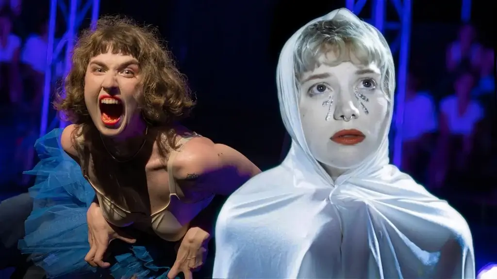 REVIEW: Revel Puck Circus Brings Bold Circus Spirit to Brighton Fringe with The Circus Yard Launch Gala 42 Official promotional photo for the show Behemoth which shows two women, one woman screaming in the background, and another woman who is Maggie Rusak wearing a white sheet over her head and holding it around her shoulders looking past the camera with white make-up.