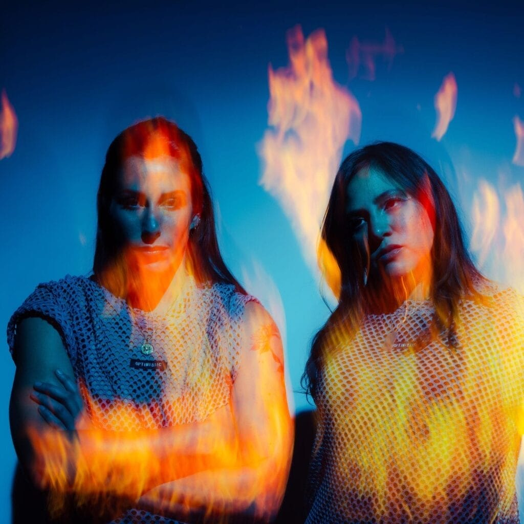 Royal She Drop Explosive Rock-Rap Anthem “New Dawn” Ahead of Upcoming Album 8 Official single cover artwork for "New Dawn" which sees the duo, Royal She, posing together with a fire filter over the top of them and a blue background.