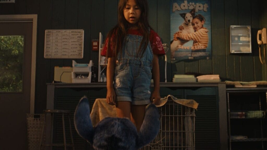 Film Review: Disney’s Lilo & Stitch (2025) Is a Nostalgic Journey That Will Make You Laugh, Cry, and Believe in ‘Ohana All Over Again 67 Lilo at the animal shelter looking at Stitch.