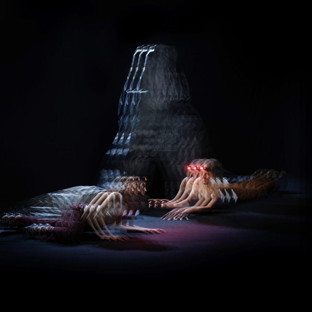 Official single cover artwork of the OLAN remix of "Crawling" which sees Dancing In Tongues on the floor next to a stone monument, all blurred out in a glitch-like filter.