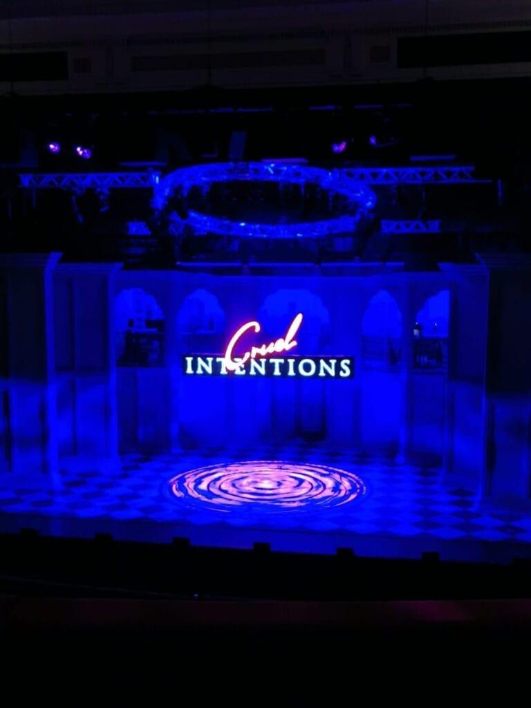 Cruel Intentions: The '90s Musical Brings Sass, Seduction, and Pure Nostalgia to Birmingham Hippodrome 66 The staging of Cruel Intentions: The '90s Musical at the Birmingham Hippodrome. The title is hanging in the middle, illuminated by LEDs.