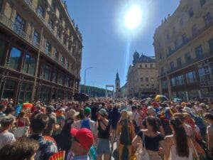 A crowd of people during Budapest Pride 2025 as they march towards the Elisabeth Bridge across the Danube river.