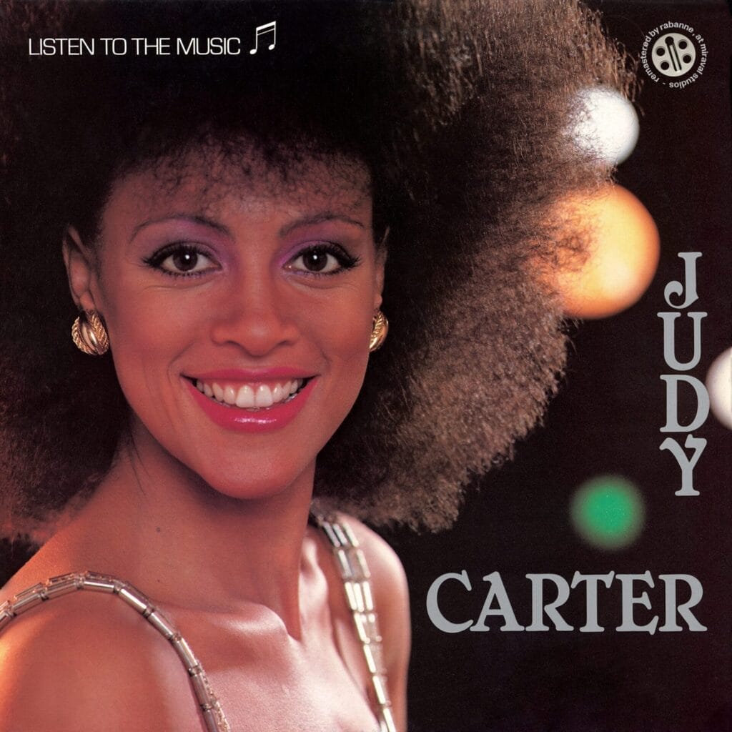 Official single cover artwork for the 2025 remaster of "Listen to the Music" which sess Judy Carter smiling at the camera with her afro hair giving '80s.