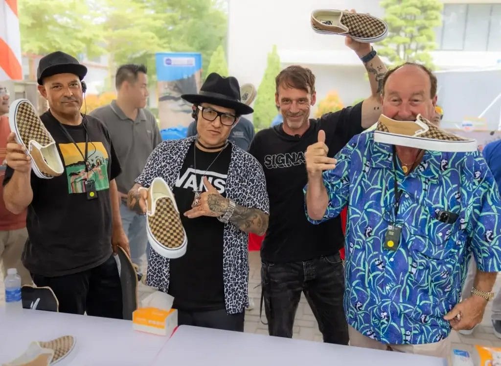 Signal, Vans & Ernest Packaging Redefine Footwear with Fully Skateable Classic Slip-Ons Made Entirely from Cardboard 37 Professional skateboarders Omar Hassan and Christian Hosoi posing with Signal Founder Dave Lee and Vans' Steve Van Doren holding the completed cardboard Vans sneaker.