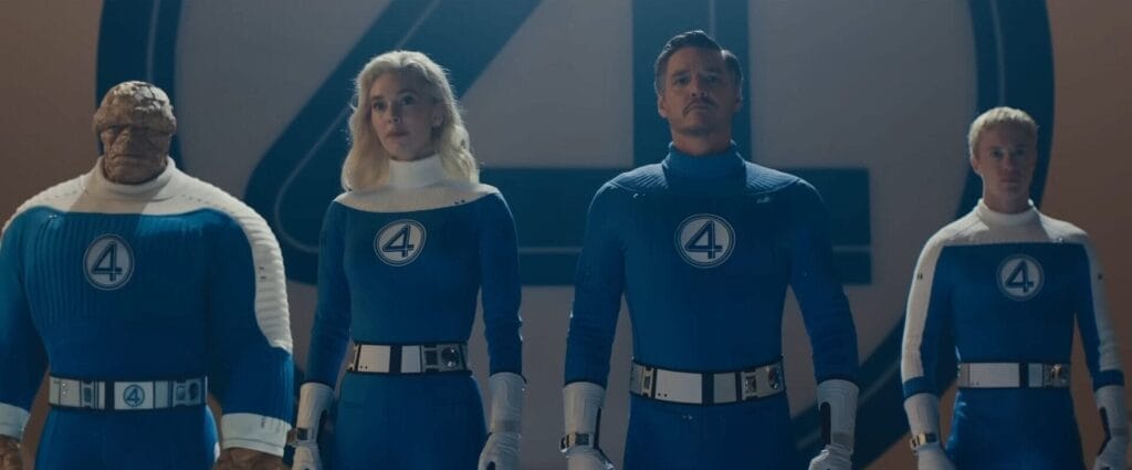 Still from the official trailer to The Fantastic Four: First Steps with all four main characters stood together wearing their Fantastic Four uniforms.