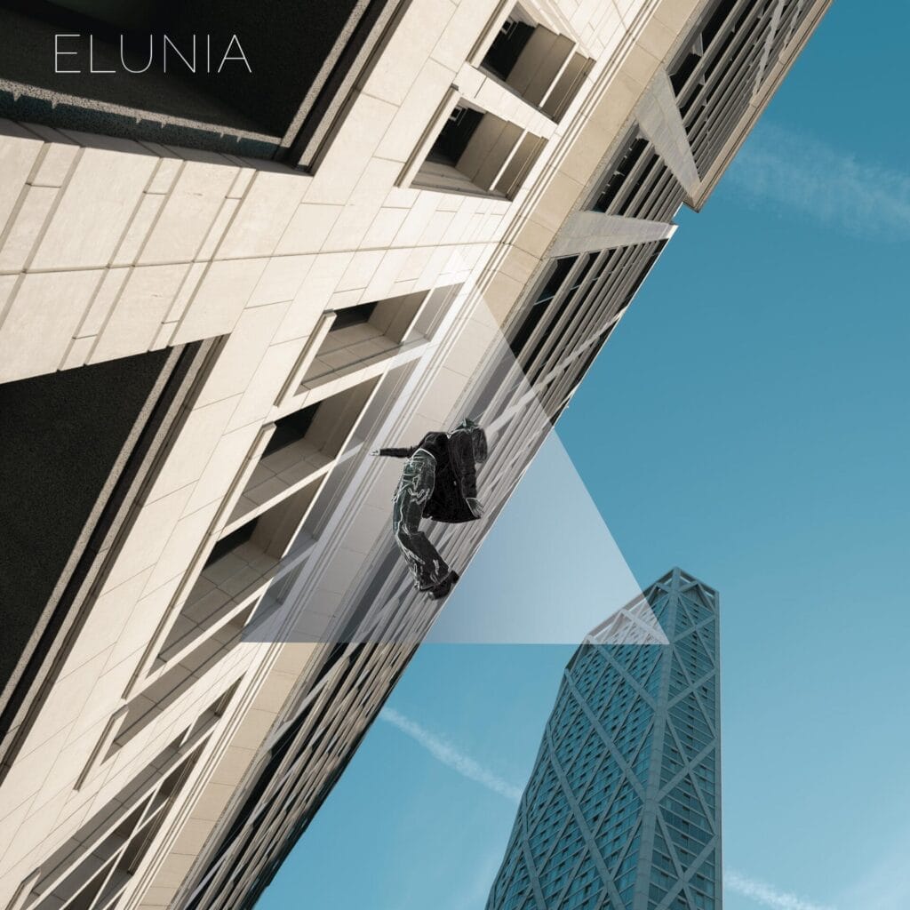 ELUNIA Pushes the Boundaries of Immersive Pop with Emotional New Track “Strobe Lights” 11 Official single cover artwork for "Strobe Lights" which shows a person in dark clothing, suspended horizontally, appearing to float against the backdrop of tall modern buildings, all under a clear blue sky.