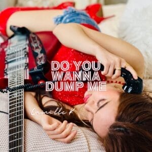 Official single cover artwork for "Do You Wanna Dump Me" which shows Camille K in a red dress and denim shorts lying on a couch holding a vintage phone. A guitar rests beside her. White text of the song's title is in the middle.